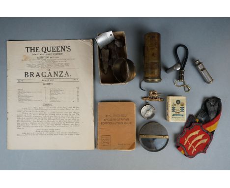 A Small Group Of Military Collectables To Include The Queen's Royal West Surrey Regiment The Braganza Magazine, The Queens Ca