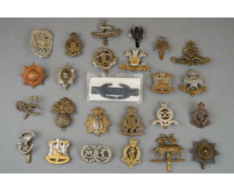 A Collection Of Approx 25 x British Military Cap Badges To Include  The Royal Artillery, The Middlesex Regiment, The Royal Hu