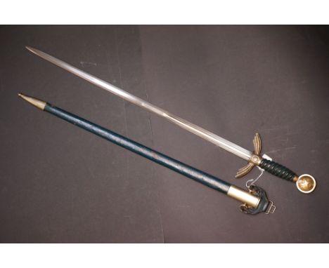A German Early Luftwaffe Officer Sword [M1935] with Hanger by David Malsch, Steinbach. The Grip Is A Carved Wood Case And Is 