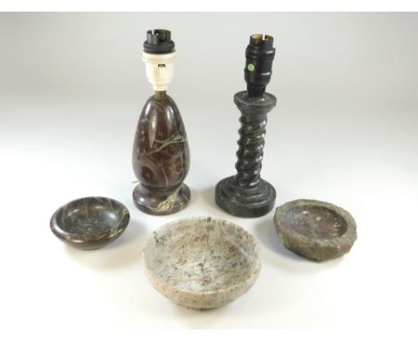 CORNISH SERPENTINE.A green Cornish serpentine spiral column lamp base, height 22cm, a red serpentine lamp base & three serpen