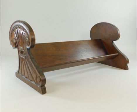 BOOK TROUGH. A mahogany book trough, one end carved 'Books' the other end carved &amp; dated '1913'. Width 44cm.