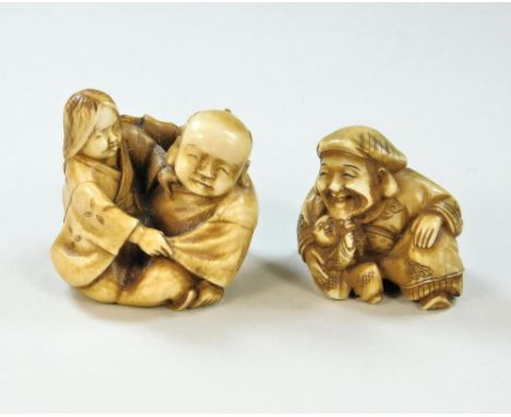 NETSUKE. An ivory, two-figure netsuke, signed &amp; a figure with baby netsuke, also signed. Largest width 3.4cm.