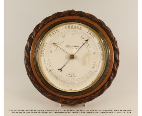 BAROMETER. A barometer/thermometer by John Adams of Southampton, in oak rope twist case. Diameter 29cm.Please note: Our in-ho