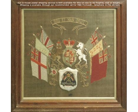 EMBROIDERED ROYAL CREST. An early 20th century, glazed & framed, embroidered Royal crest surrounded by the Union & Regional f