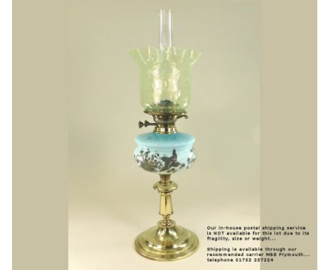 OIL LAMP. A Victorian oil lamp, with Aesthetic Movement glass fount &amp; vaseline glass shade. Height 63cm. Please note: Our