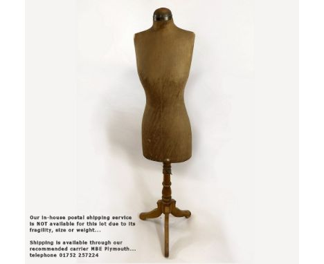 MANNEQUIN An antique calico covered mannequin on adjustable tripod stand (32B 25W 34H). Please note: Our in-house postal serv