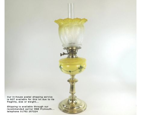 OIL LAMP. A Victorian oil lamp with yellow stencilled fount &amp; etched shade. Height 63cm. Please note: Our in-house postal