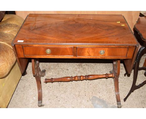 A reproduction mahogany sofa table