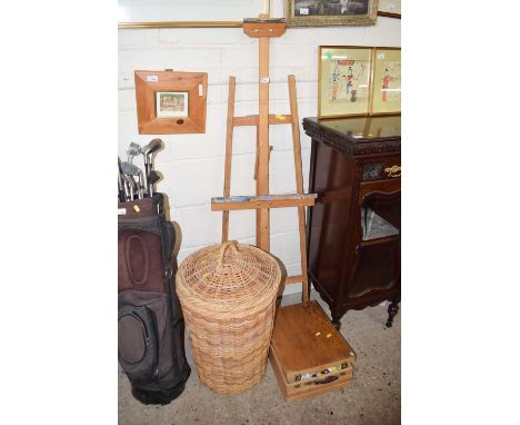 An artists easel together with a box of artists paints