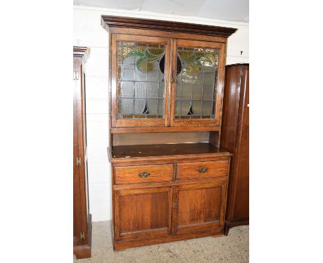 Late 19th Century oak sideboard with lead glazed top section and base with drawers and doors
