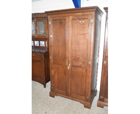 20th Century double door wardrobe by Simon Simpson of Norwich with two panelled doors, brass fittings and bracket feetDimensi