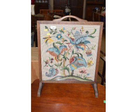 A tapestry fire screen