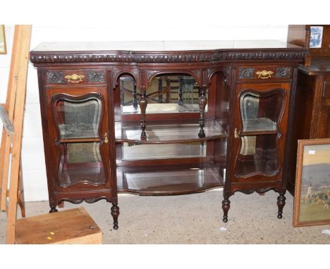 A late Victorian mahogany sideboard with glazed side doors and a central mirrored panel