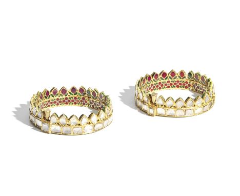 A pair of diamond-set enamelled gold bangles North India, 18th Centuryeach of circular form with hinge and screw clasp, the b