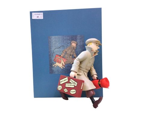 TINTIN MODEL FIGURE, BY MOULINSART modelled holding a briefcase and sleeping bag, lacking makers name. along with another Tin