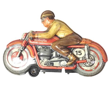 TIN MOTORCYCLE MODEL, MAKER TECHNOFIX modelled with seated rider, bearing makers name to side18cm long