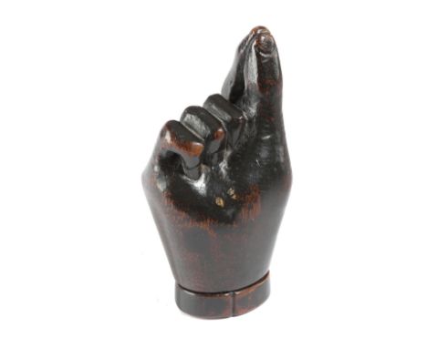 A TREEN 'PINCH OF SNUFF' SNUFF BOX SECOND HALF 19TH CENTURY carved in the form of a hand, the base with a pull-off cover 11cm