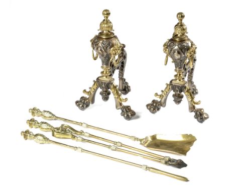 A PAIR OF STEEL AND BRASS ANDIRONS IN GEORGE II STYLE LATE 19TH CENTURY each leaf decorated and of inverted baluster form, wi
