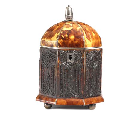 λ A GEORGE IV TORTOISESHELL OCTAGONAL TEA CADDY C.1820-25 the hinged domed lid inlaid with pewter stringing, with a silver co