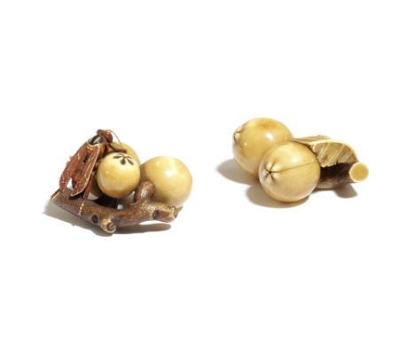 λ TWO JAPANESE IVORY NETSUKE OF FRUITING BRANCHES MEIJI PERIOD, 19TH CENTURY both carved as biwa fruits on branches, one with
