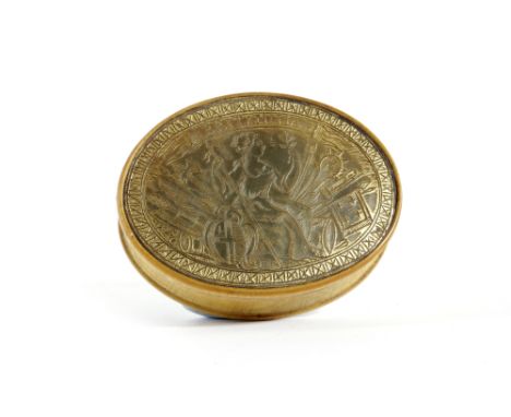 A HORN OVAL PARCEL GILT SNUFF BOX EARLY 18TH CENTURY engraved with Britannia with war trophies, titled and with a hatched bor