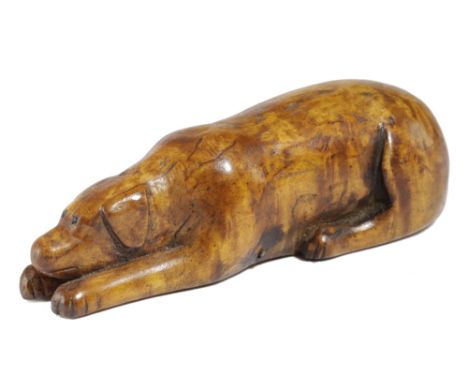 A SCANDINAVIAN TREEN BIRCH DOG SNUFF BOX PROBABLY SWEDISH, SECOND HALF 19TH CENTURY carved in the recumbent pose, the undersi