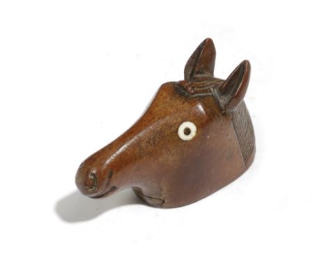 A TREEN HORSE'S HEAD SNUFF BOX C.1840 naively carved with bone inset eyes, the underside with a sliding cover with stop 8.5cm