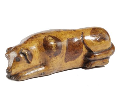 A SCANDINAVIAN TREEN BIRCH DOG SNUFF BOX PROBABLY SWEDISH, MID-19TH CENTURY carved in the recumbent pose and stained with spo