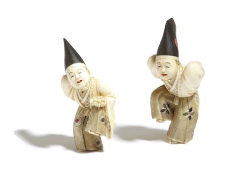 λ A PAIR OF JAPANESE WOOD, LACQUER AND IVORY NETSUKE MEIJI PERIOD, 19TH CENTURY modelled as two sambaso dancers, the men wear