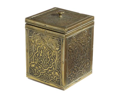 AN ISLAMIC BRASS TEA CADDY LATE 19TH CENTURY decorated with panels of scrolling leaves, with a lift-off cover revealing a met