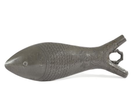 A PEWTER POWDER FLASK IN THE FORM OF A FISH 19TH CENTURY with wriggle work decoration and dated '1864', with initials 'C M O 