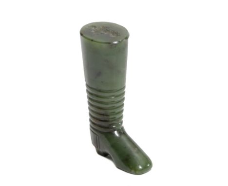 A SPINACH GREEN NEPHRITE JADE DESK SEAL POSSIBLY RUSSIAN, 19TH CENTURY in the form of a boot, the matrix engraved with a sea 