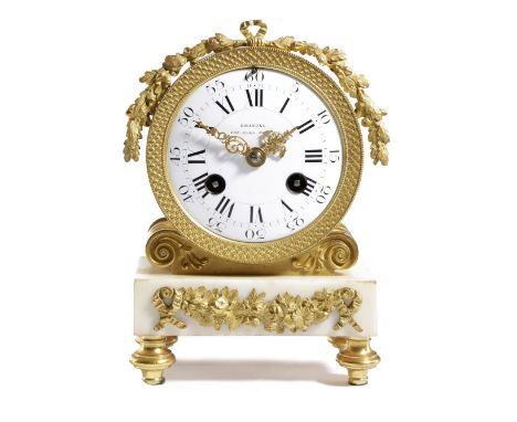 A REGENCY ORMOLU AND WHITE MARBLE MANTEL CLOCK RETAILED BY EMANUEL, C.1810-20 the brass eight day drum movement striking on a