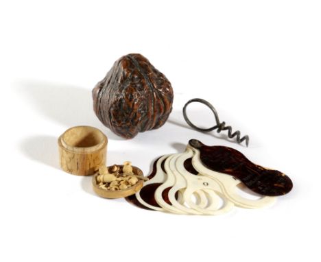 λ A SCANDINAVIAN CARVED BIRCH COLLECTION OF MICRO-SCULPTURE ITEMS POSSIBLY FOR A DOLL'S HOUSE including: barrels, a teapot, p