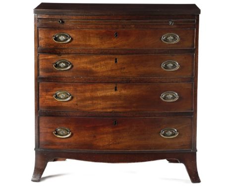 A LATE GEORGE III MAHOGANY BOWFRONT CHEST C.1800-10 the top with a reeded edge, above a baize lined brushing slide and four g