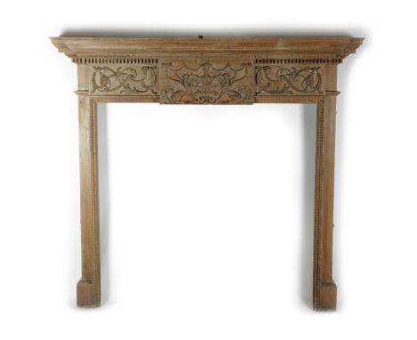 A CARVED PINE FIRE SURROUND / CHIMNEY PIECE IN ADAM STYLE LATE 19TH CENTURY the breakfront mantel above leaf and dentil mould