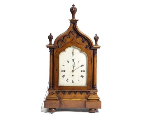 A BURR OAK GOTHIC REVIVAL CHIMING BRACKET CLOCK BY BARNARD OF LONDON, C.1825-30 the brass three train movement with turned pi