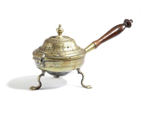 AN 18TH CENTURY BRASS BURNER OR WARMER POSSIBLY DUTCH, C.1740 the hinged pierced lid decorated with stylised tulips, the inte