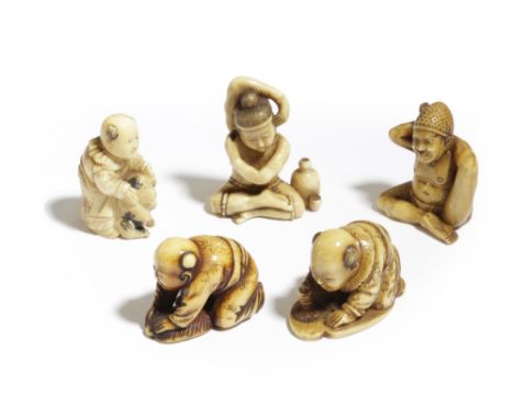 λ FIVE JAPANESE IVORY NETSUKE MEIJI PERIOD, 19TH CENTURY three carved as boys: one drawing a large character on the floor, po