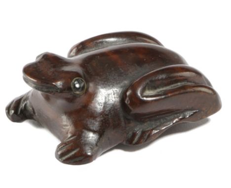 A SMALL TREEN FROG SNUFF BOX C.1860 with ebonised eyes, the underside with a hinged cover 5.7cm long