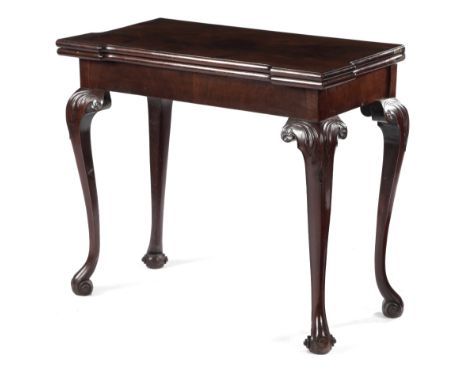 A GEORGE II MAHOGANY CARD TABLE C.1740-50 the breakfront hinged and fold-over top supported on a concertina action, revealing