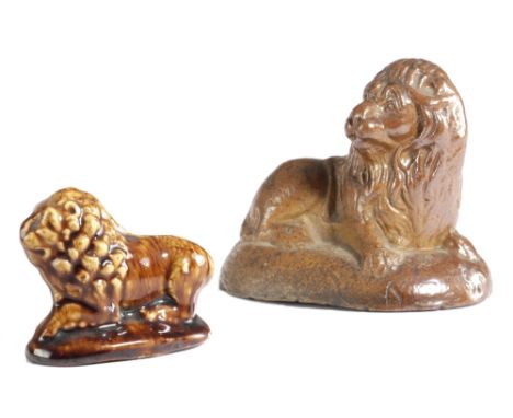 A SALTGLAZE STONEWARE POTTERY MODEL OF A RECUMBENT LION MID-19TH CENTURY the underside with an inscription stating that it wa