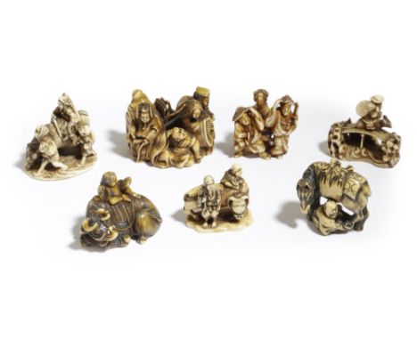 λ A COLLECTION OF SEVEN JAPANESE IVORY NETSUKE MEIJI PERIOD, 19TH CENTURY variously depicting groups of travellers and other 