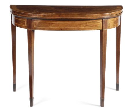 λ A LATE GEORGE III MAHOGANY CARD TABLE C.1800-10 inlaid with boxwood and ebonised stringing, the 'D' shaped fold-over top wi