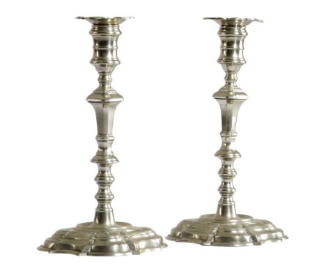 A PAIR OF GEORGE II PAKTONG CANDLESTICKS C.1740-50 each with a detachable foliate nozzle, above a turned tapering stem and a 