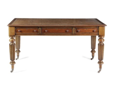 A MAHOGANY WRITING TABLE IN WILLIAM IV STYLE 20TH CENTURY the moulded edge top inset with gilt tooled brown leather, above th