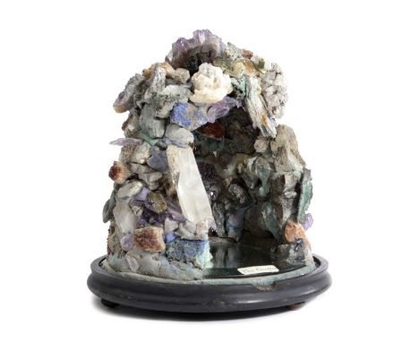 A SPECIMEN MINERAL 'GROTTO' GROUP containing assorted minerals, including: quartz crystal, amethyst and lapis lazuli, mounted