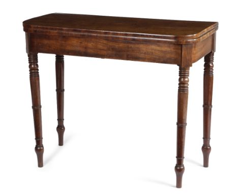 A REGENCY MAHOGANY CARD TABLE C.1810 the 'D' shape fold-over top on twin gate supports, with ring turned tapering legs, the u