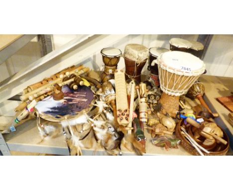 MIXED MUSICAL INSTRUMENTS. Shelf of wood musical instruments including bongo drums