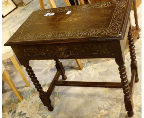 CARVED OAK TABLE. Carved oak table with green man drawer handle and bobbin turned legs